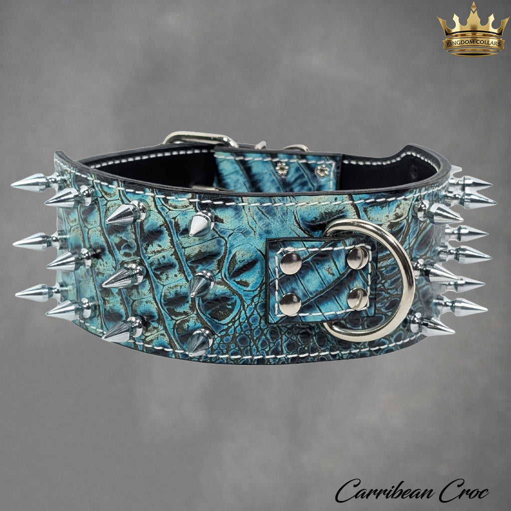 Blue textured leather dog collar with spikes on a gray background