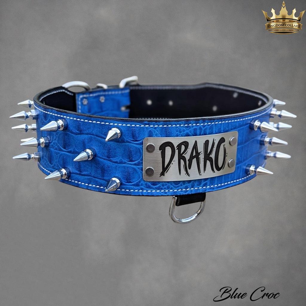 Blue leather dog collar with spikes and 'DRAKO' branding on a gray background