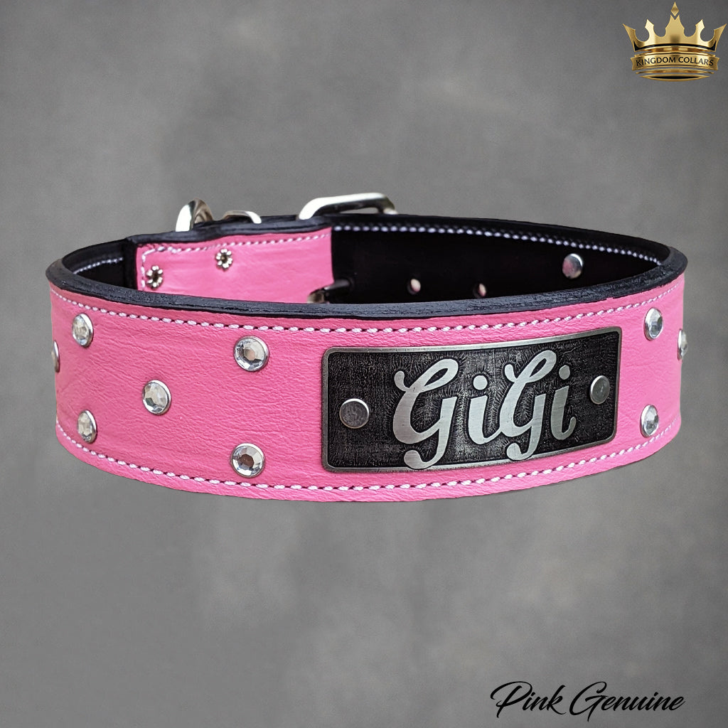 A pink faux leather dog collar with silver studs and a black metal nameplate engraved with 'Gigi'. The collar is shown on a textured gray background with a 'Pink Genuine' logo in the bottom right corner.