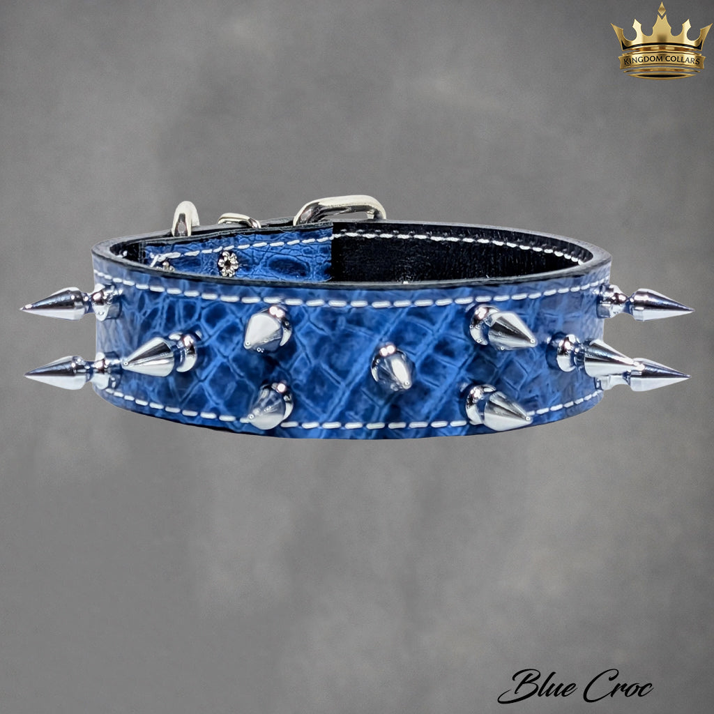 Blue crocodile-patterned dog collar with silver spikes on a gray background