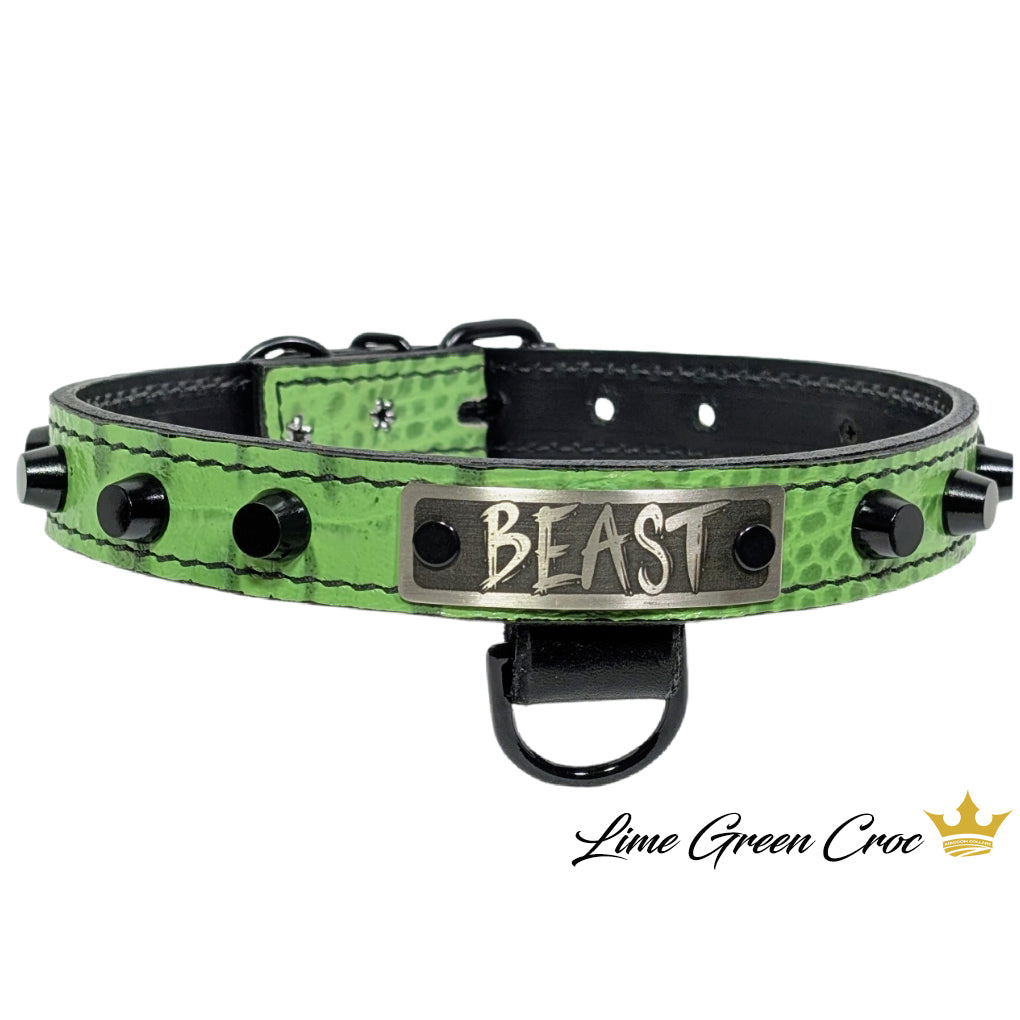 Green crocodile texture dog collar with 'BEAST' tag on a white background