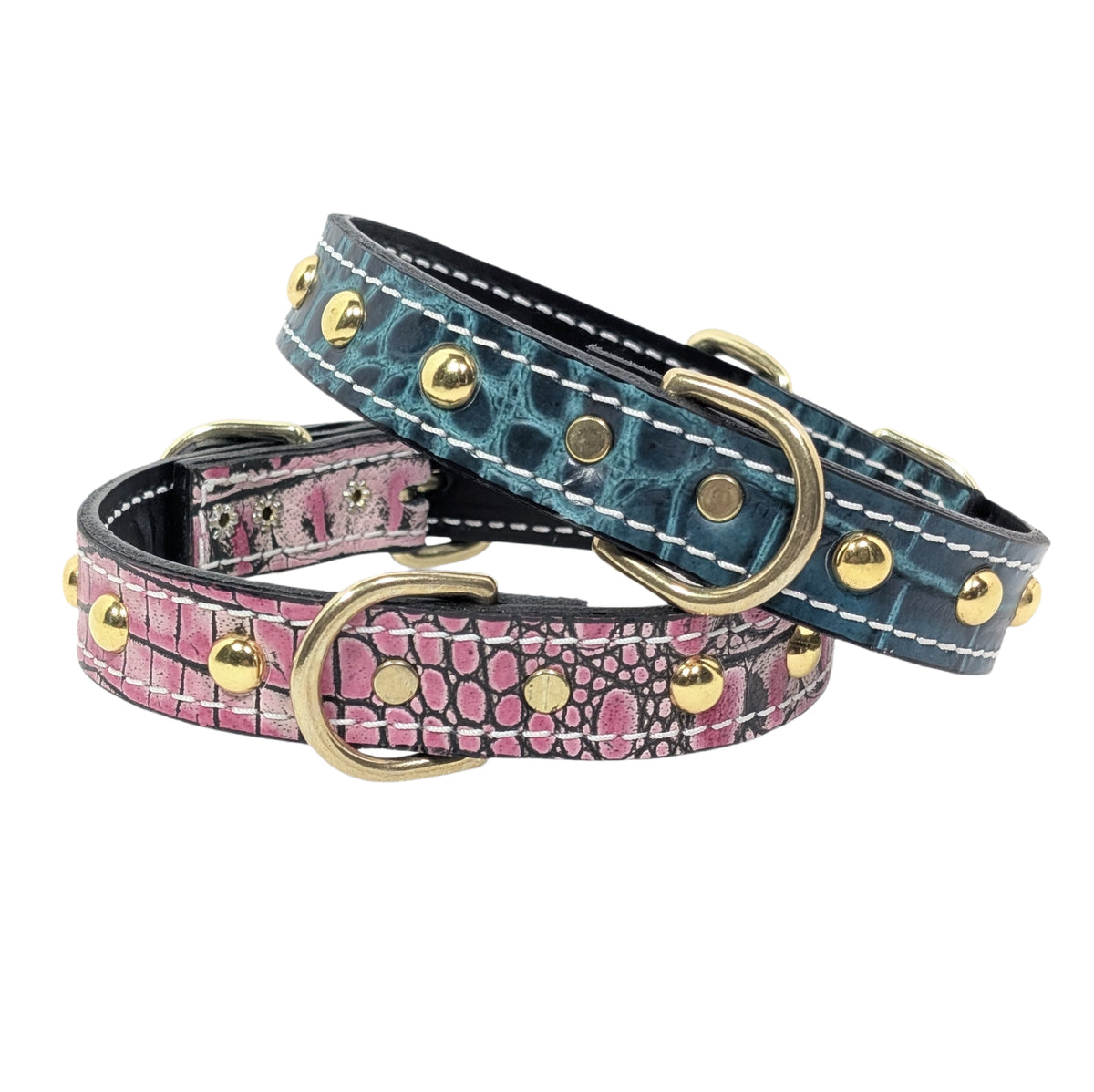 Two dog collars with patterned leather and gold studs on a white background